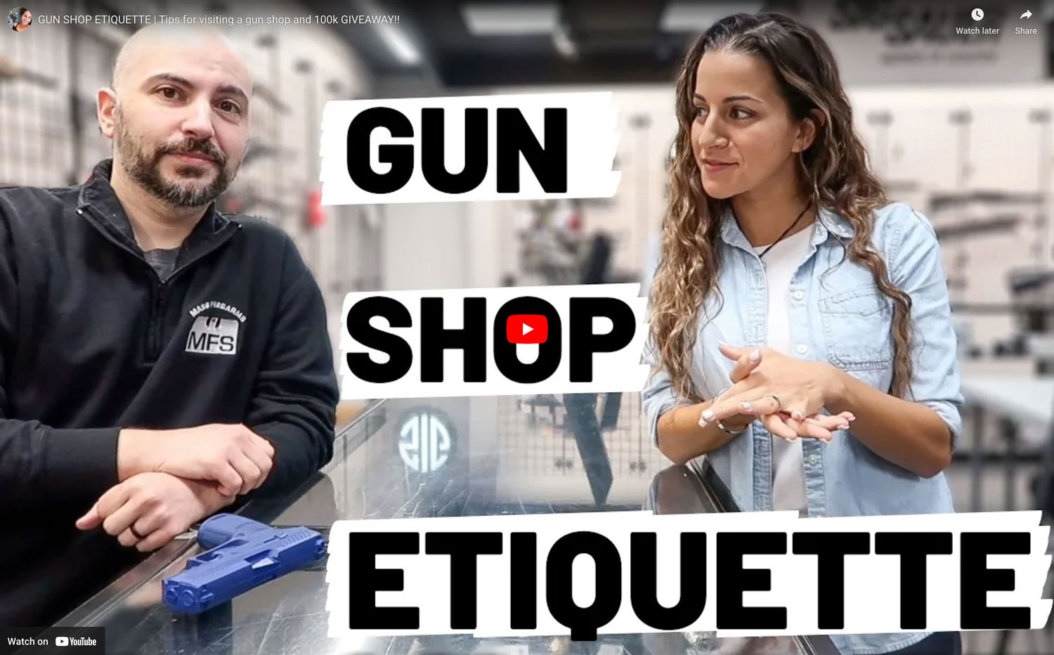 A woman standing at a counter with a Mass Firearms School employee with the words Gun Shop Etiquette superimposed on the image