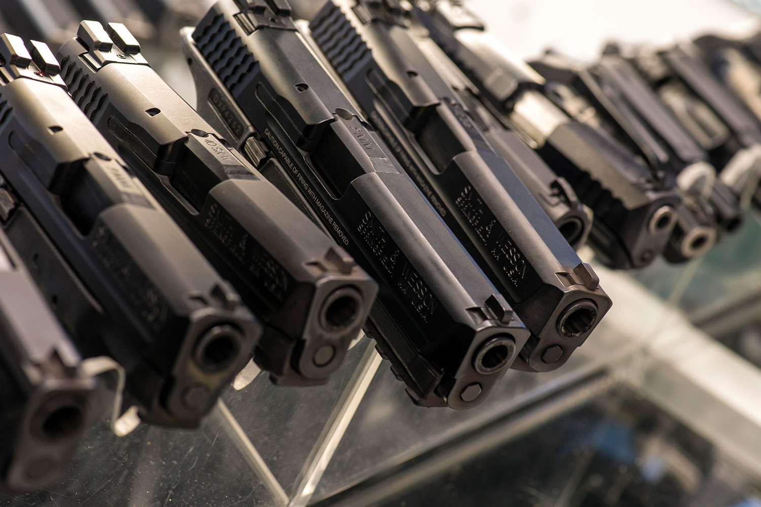 Detail view of hand guns in a display case